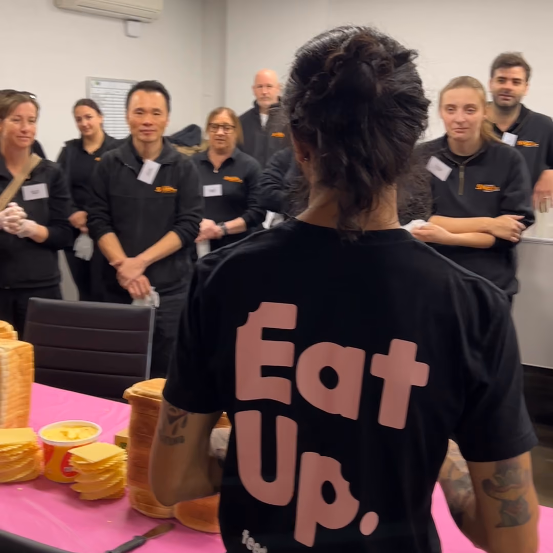 Eat Up Australia volunteer leading a sandwich-making session with the Sheen team.