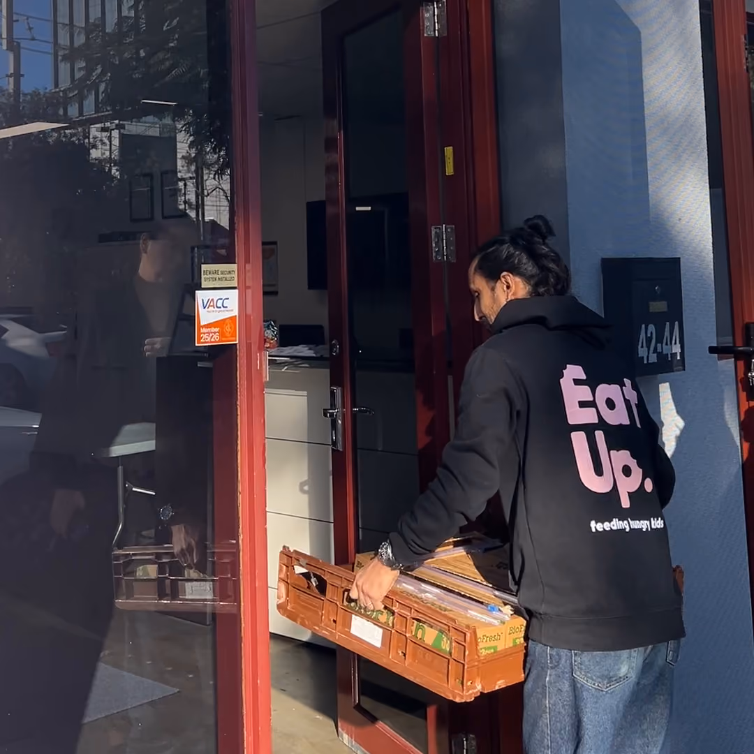 Eat Up Australia team member collecting sandwiches from Sheen Panel Service.