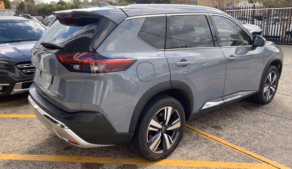 After repair photo of a grey Nissan X-Trail with the rear side restored.