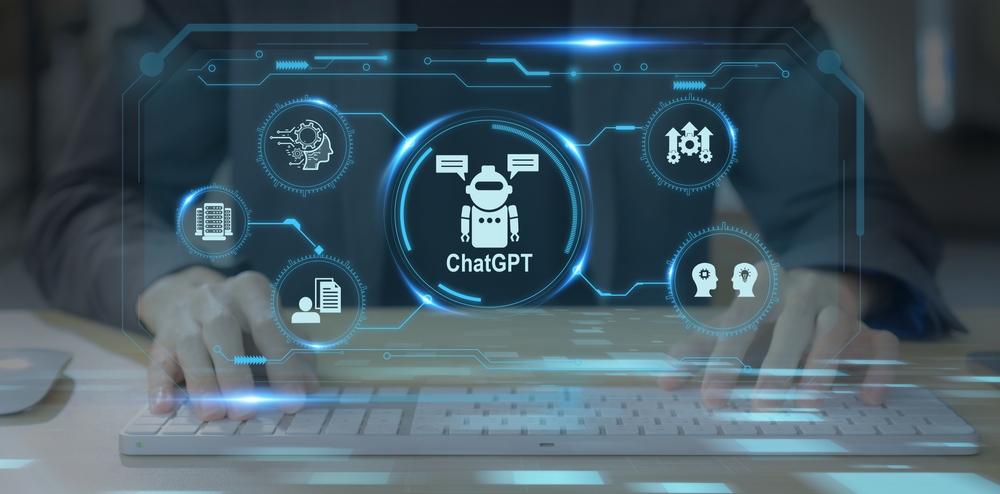A man typing on a keyboard with a holographic pop up showing AI related pop ups and a ChatGPT robot in the middle