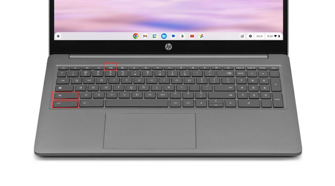 A Google Chromebook's keyboard with red squares around the control, shift, and show windows keys