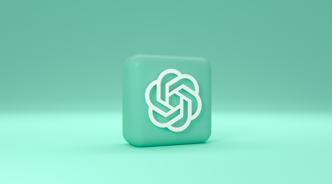 The ChatGPT logo in the shape of a 3D block on their signature mint green background