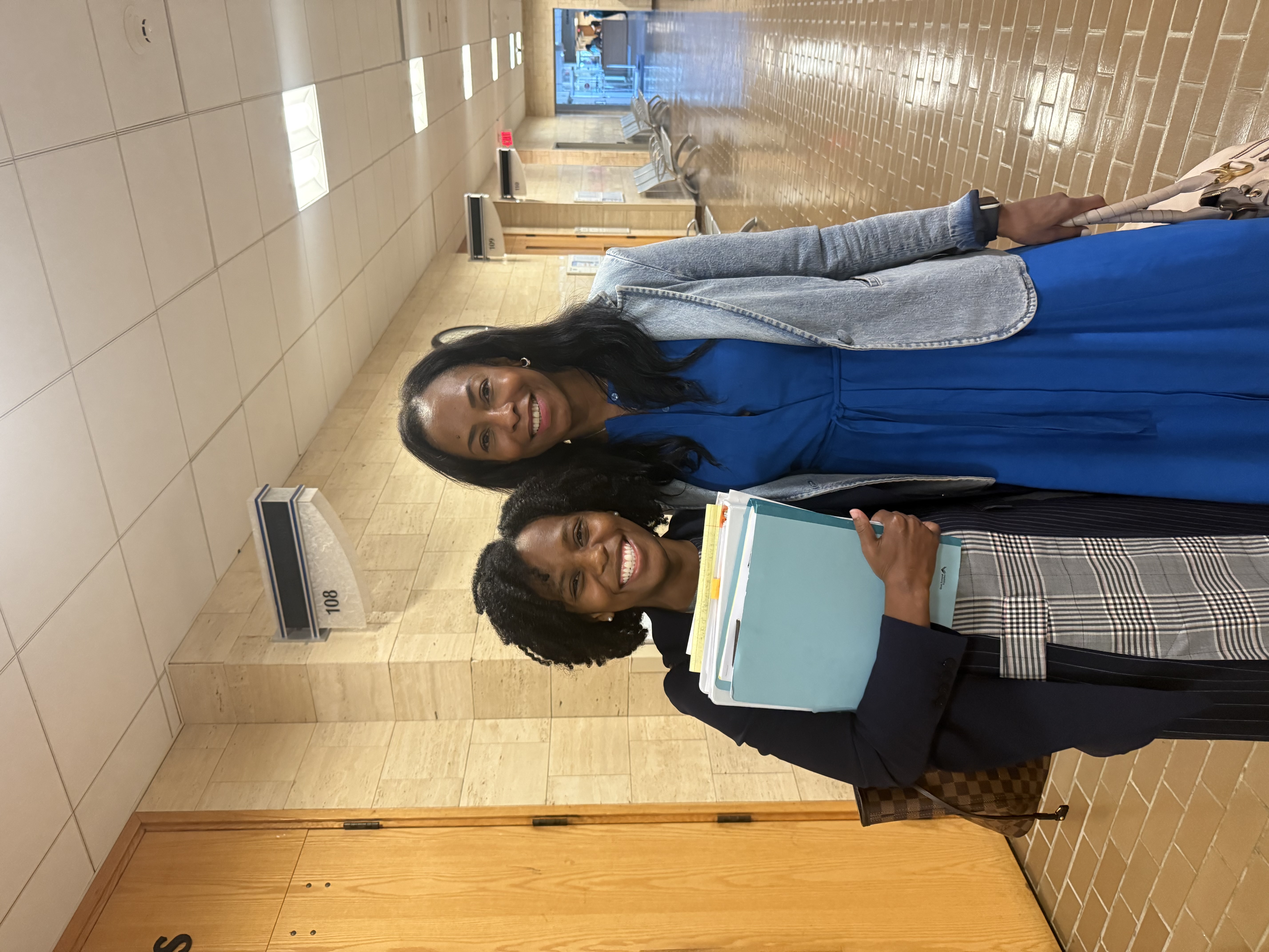 Angel Murphy and A Client in the Courthouse after winning a case