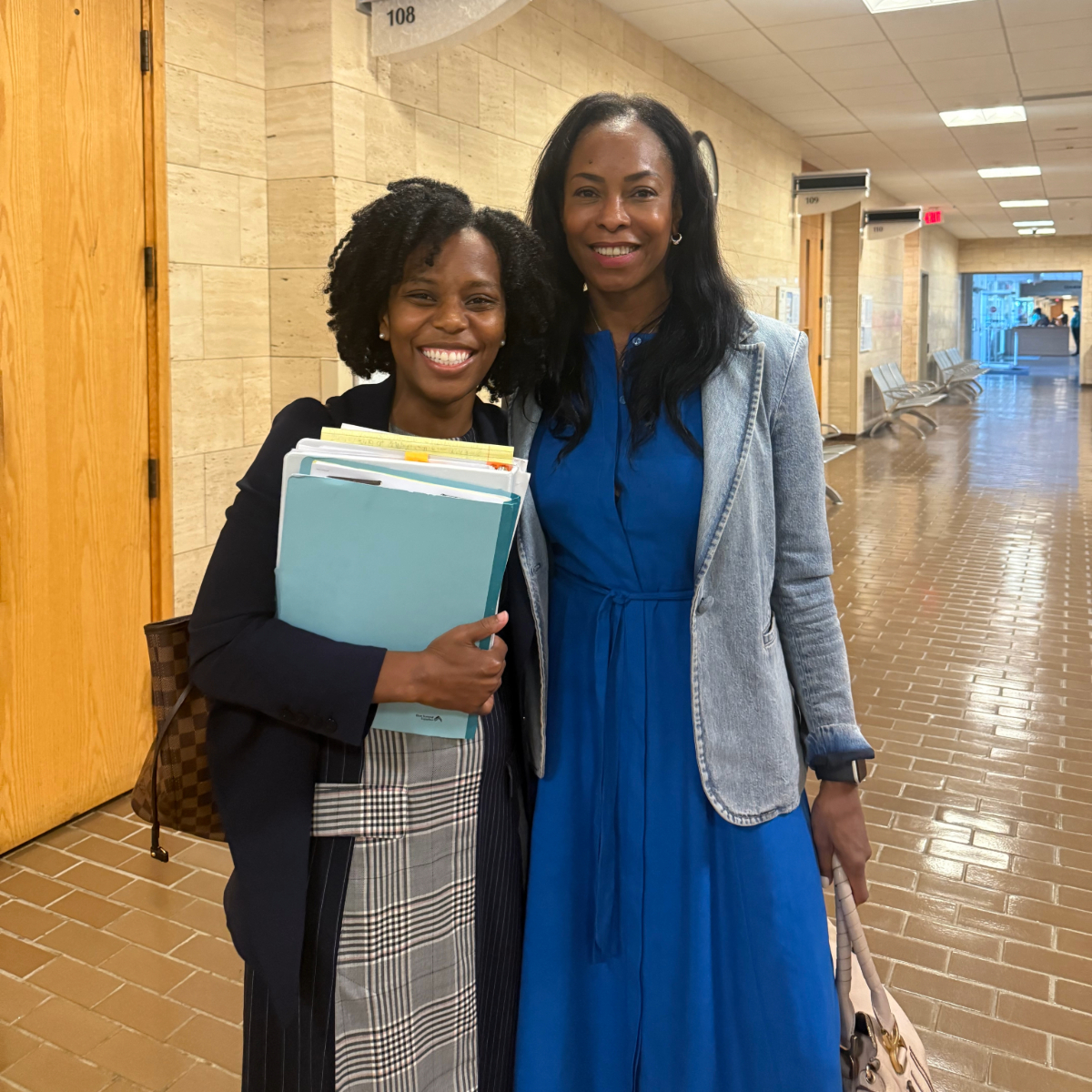 Angel Murphy and A Client in the Courthouse after winning a case
