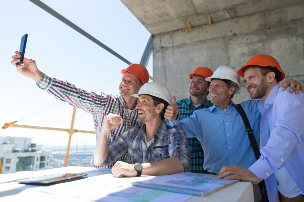 A construction team happy and clear on their financial roles.