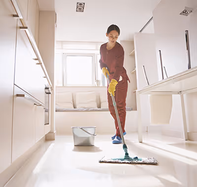 Technician cleaning a fitness center.