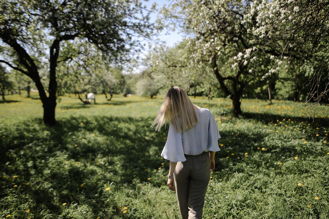 Free Woman Standing Near The Tree Stock Photo