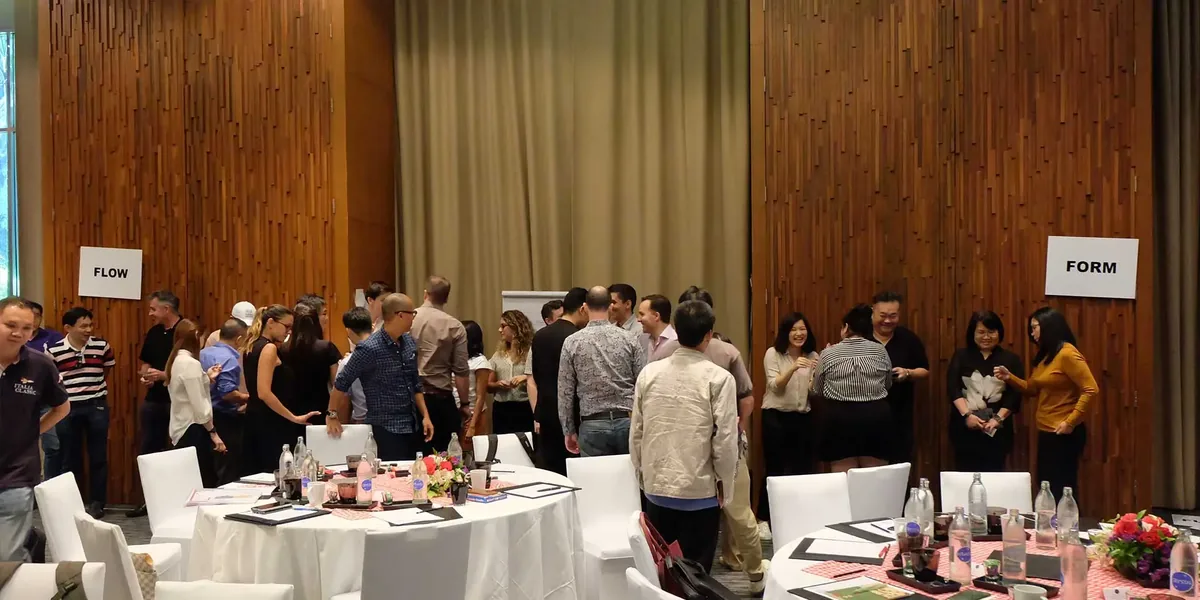 Brand Connect team grouping by style between Flow and Form signs at their offsite