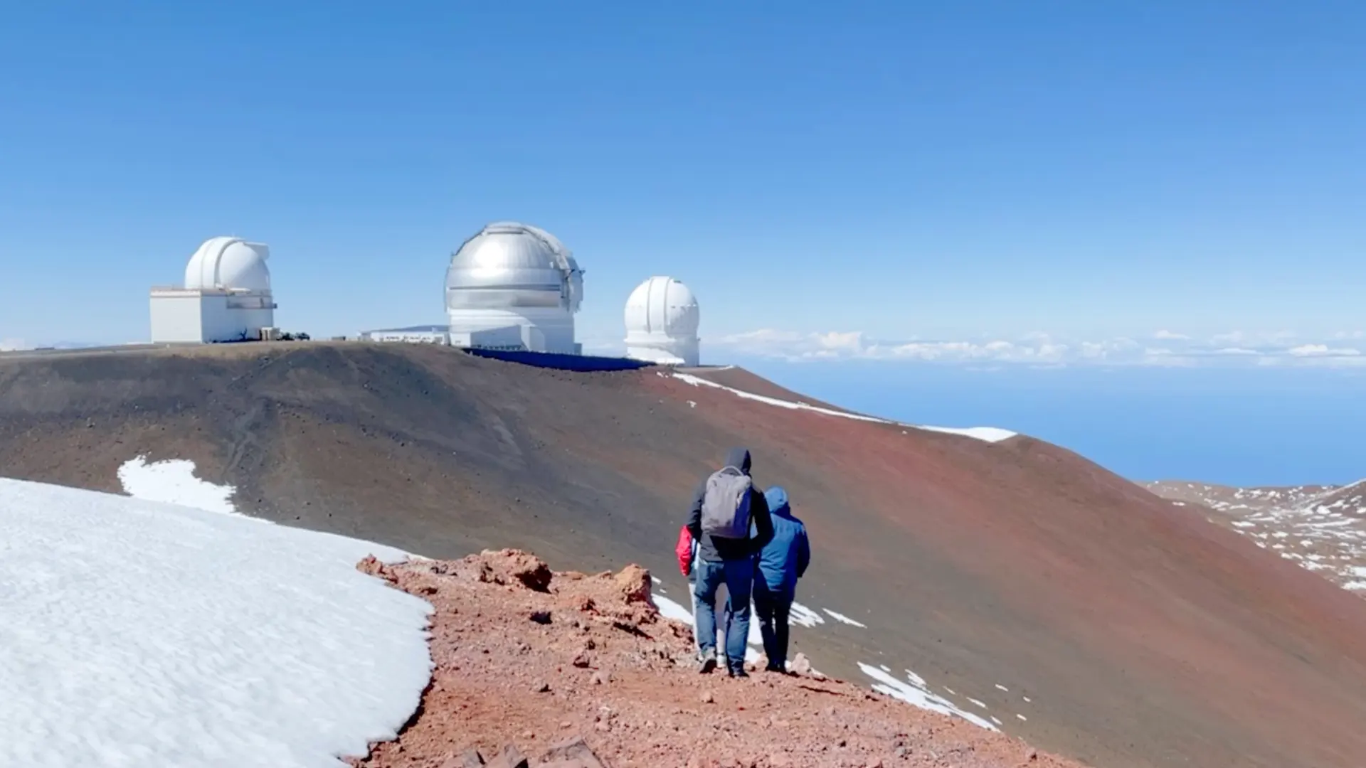 Asil and other walking on top of Manua Kea towards the observatory