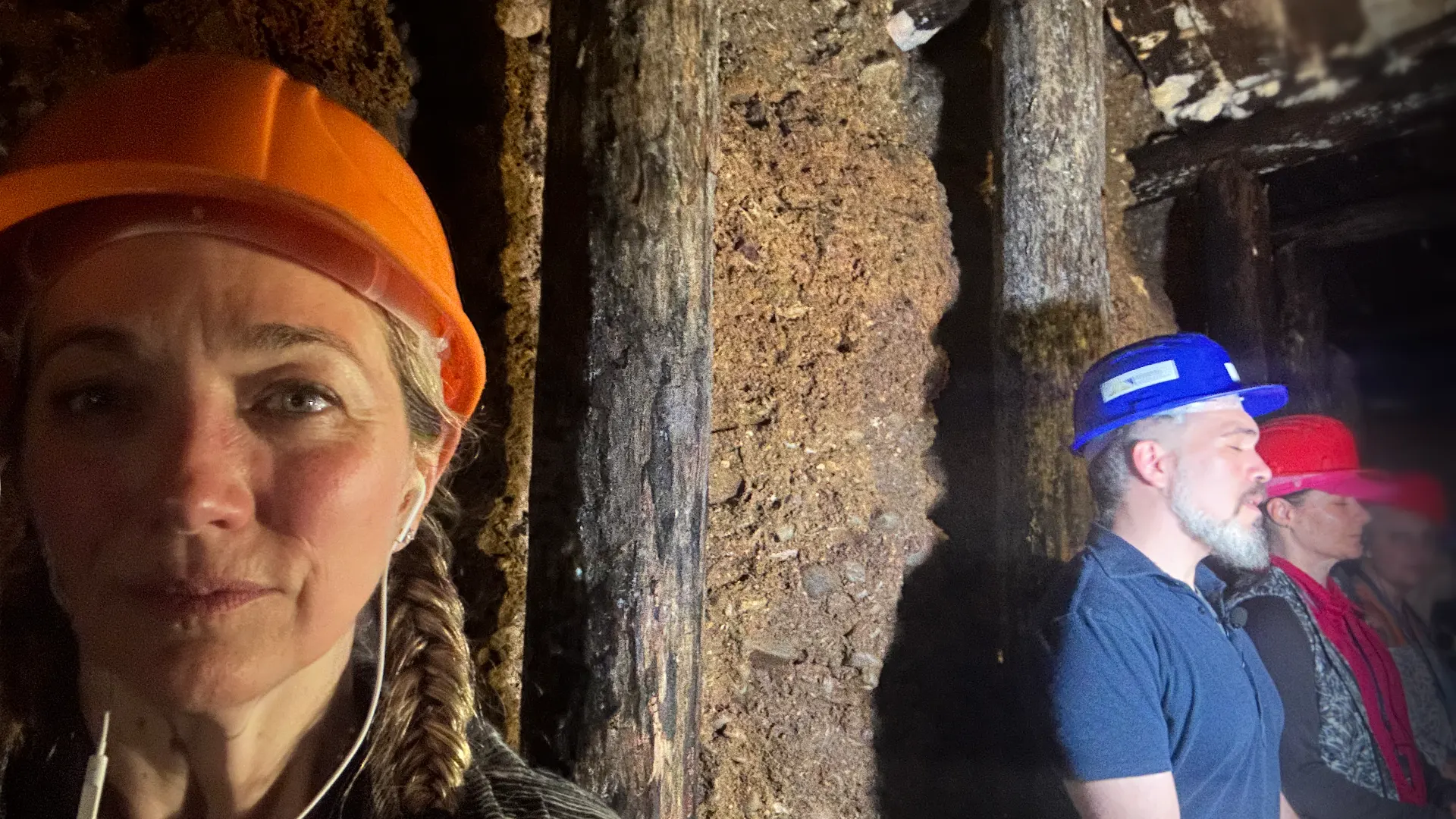 Christel, Asil and the team meditating in a tunnel
