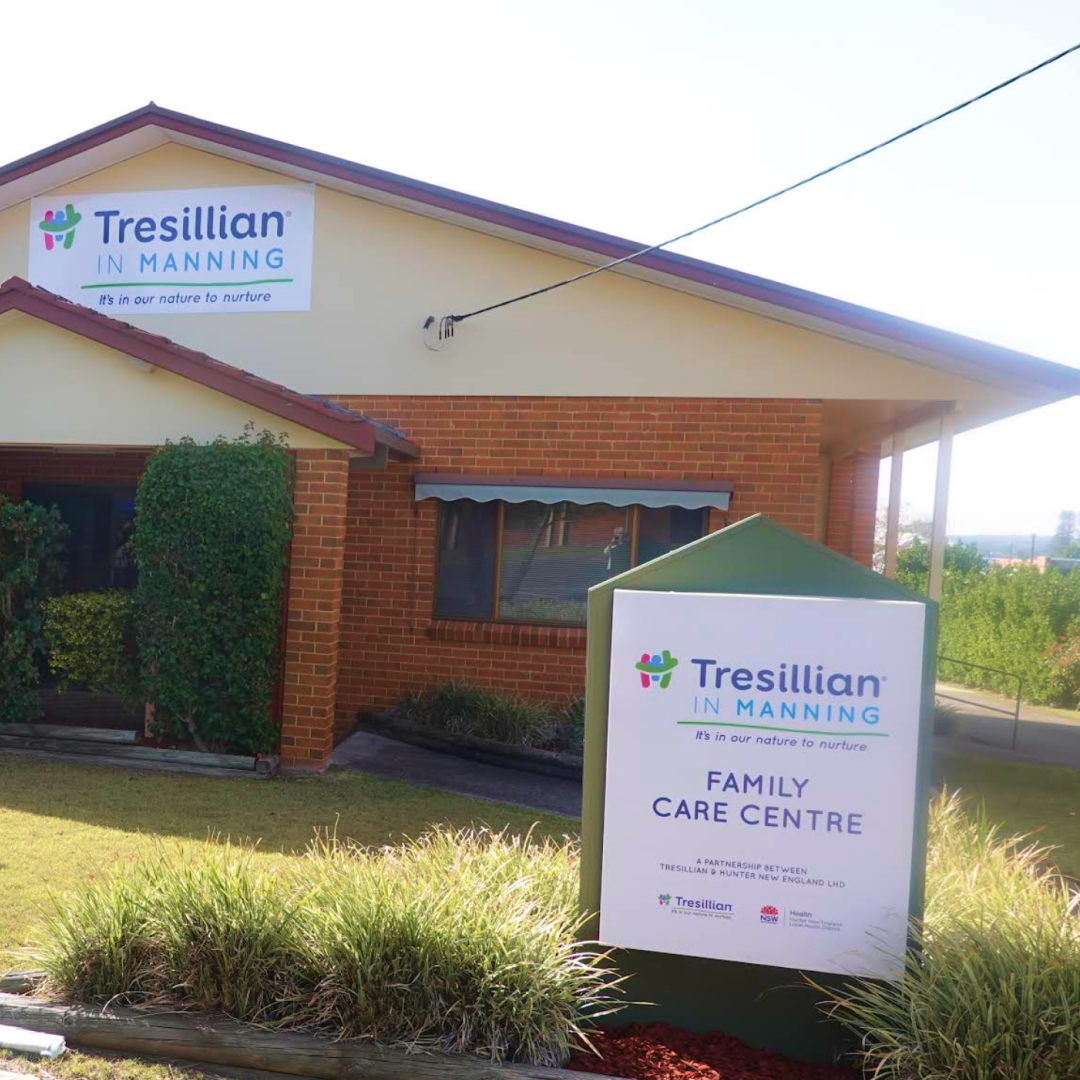 A cozy room with a couch, coffee table, and comfortable chairs, creating a warm and inviting atmosphere.