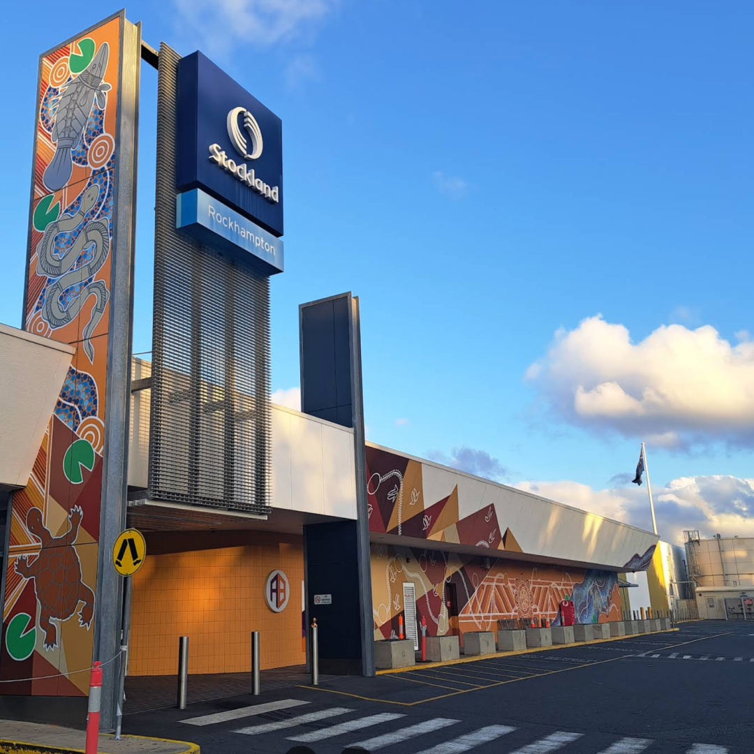 A cozy clinical living room with a couch, coffee table, and comfortable chairs, creating a warm and inviting atmosphere.