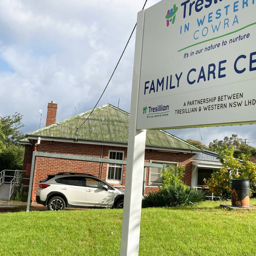 A cozy room with a couch, coffee table, and comfortable chairs, creating a warm and inviting atmosphere.