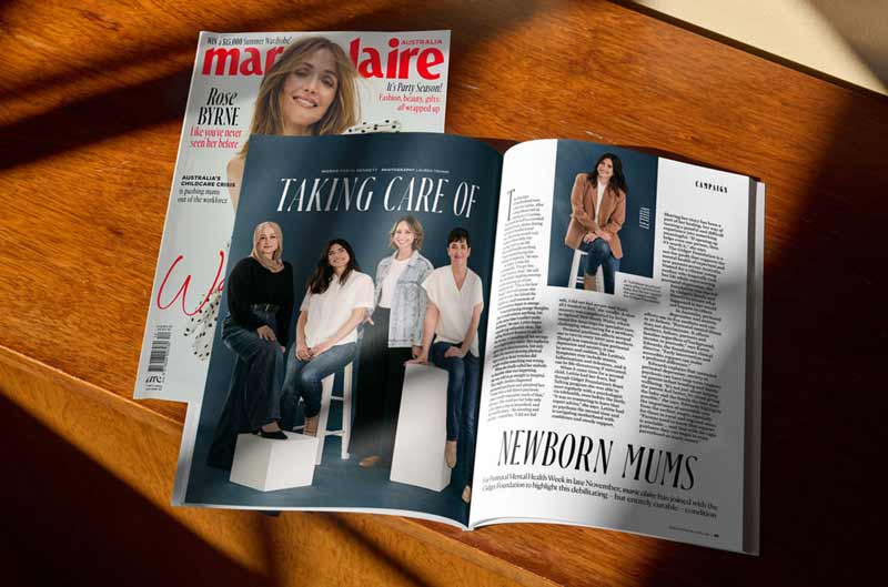 Marie Claire magazine open to an article on newborn mums with four women posing on stools and blocks.