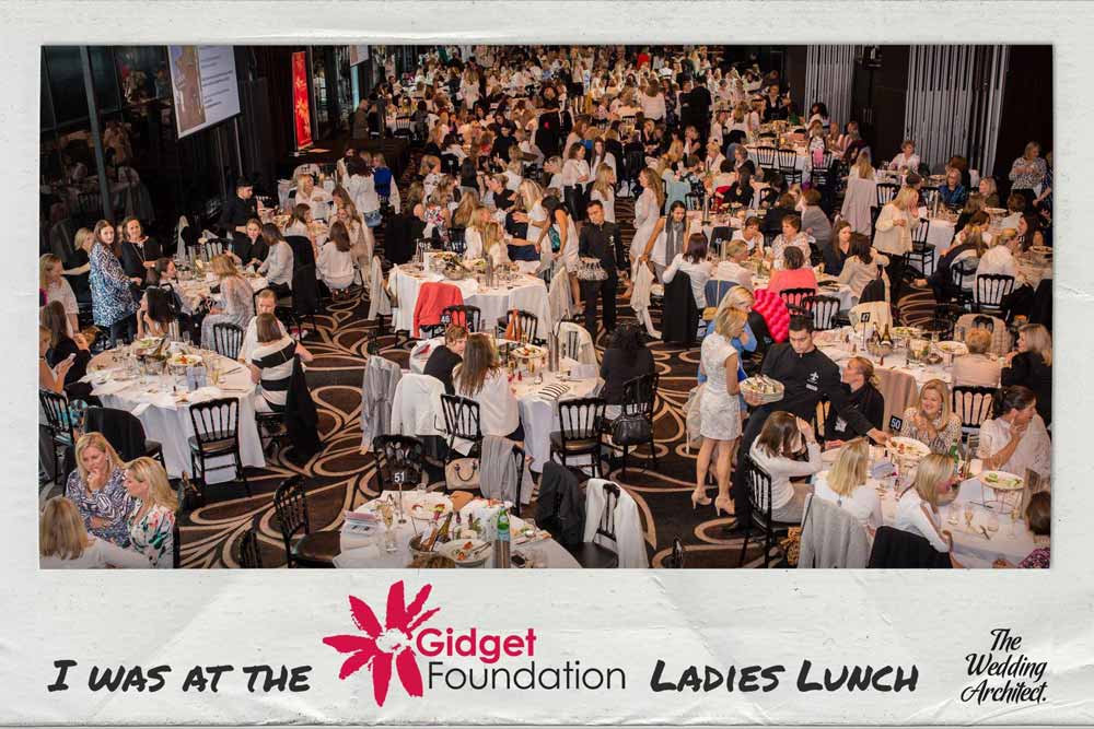 Large group of women seated at round tables in a banquet hall during the Gidget Foundation Ladies Lunch event.