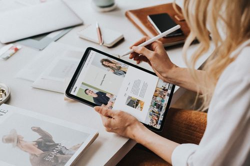 Woman using Emporium Creative Hub Custom Website Designed by Creative Revolution