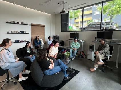Architecture students and La Union Studio team seated together in the studio lounge during a firm tour