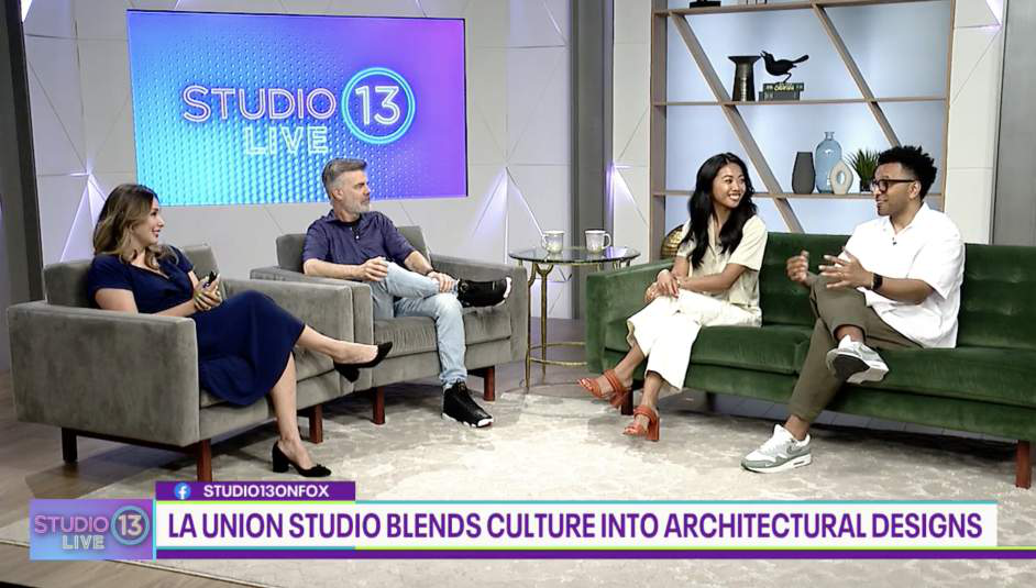 Television interview set showing four people seated on couches, with an on-screen graphic reading 'La Union Studio blends culture into architectural designs'