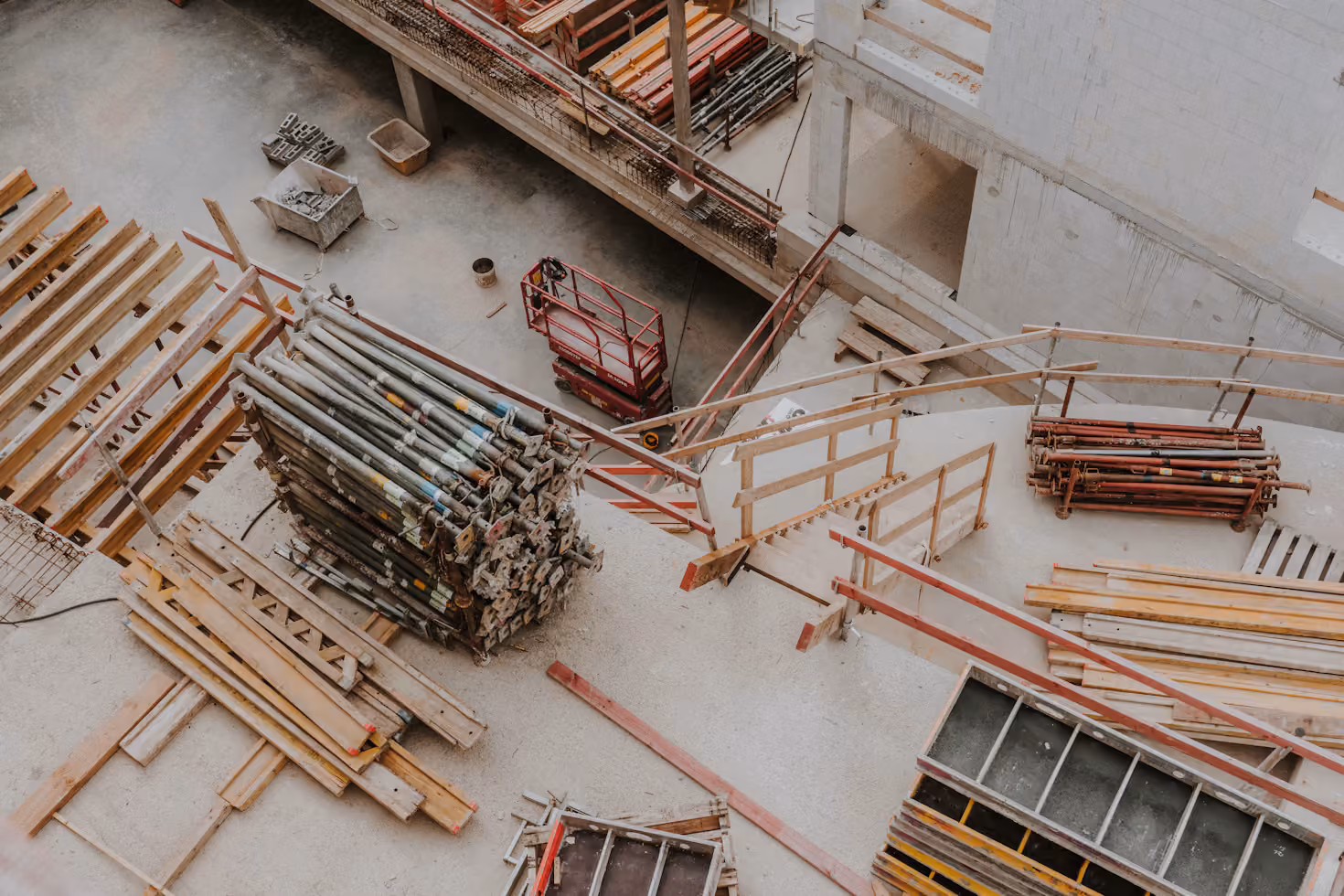 Lumber and steel framing materials stacked on a Seattle construction site.