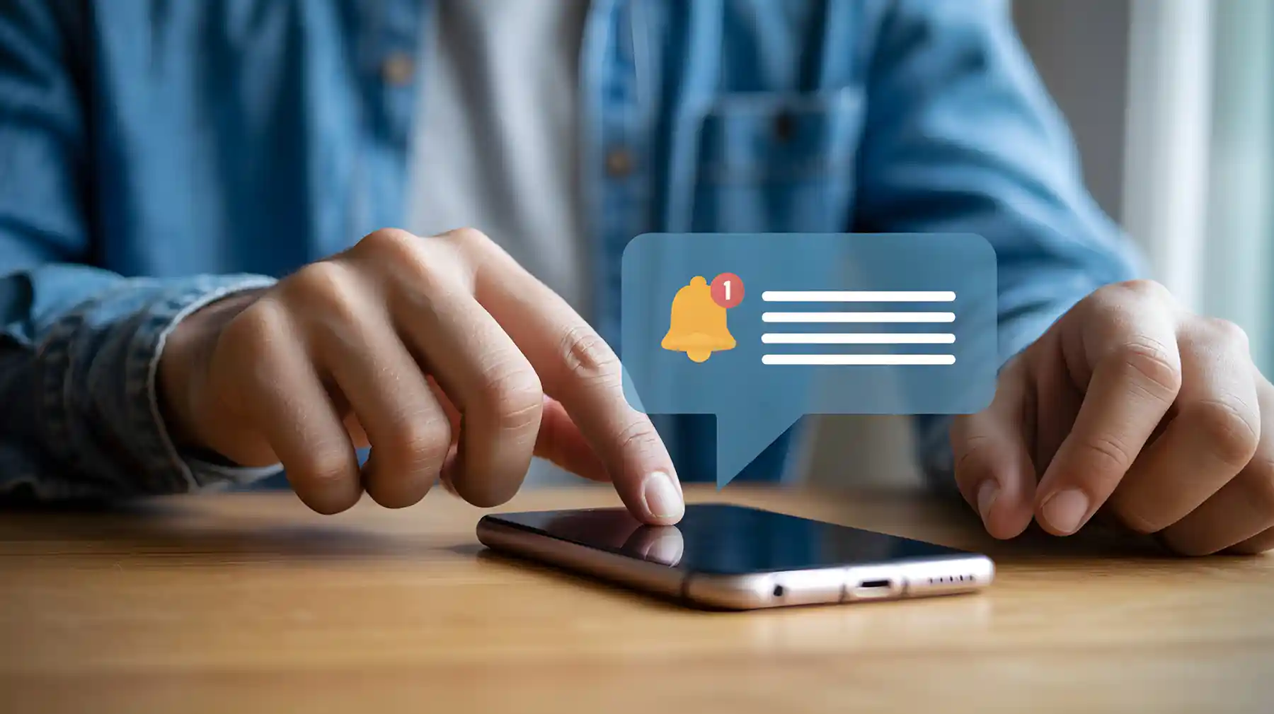 Man in blue shirt checking phone for new notifications, staying connected and informed.