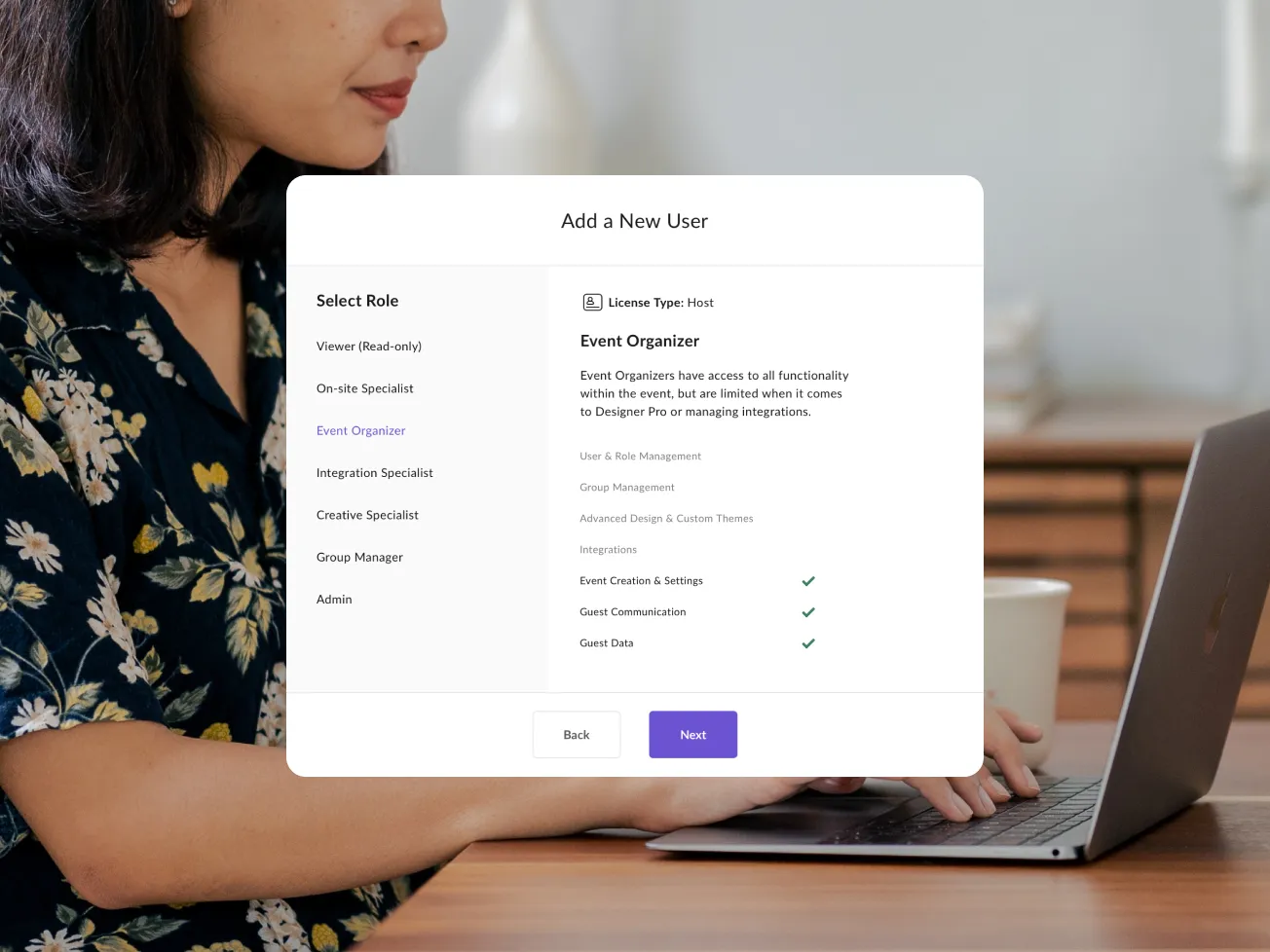 A person at a laptop with a Splash 'Add a New User' dialog open, showing role options including Viewer, On-site Specialist, Event Organizer, and Admin with customizable permissions