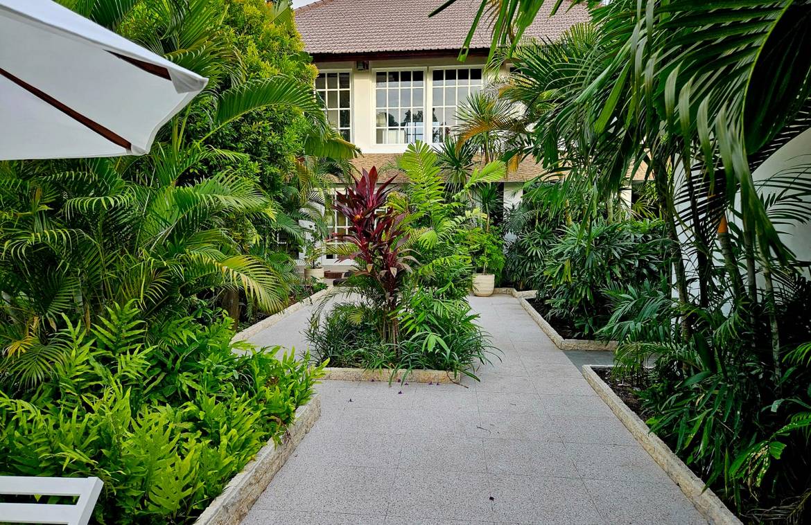 Located in the heart of the fashionable Seminyak district, this superb architecturally designed villa is perfect for resident as well as a money maker villa. Surrounded by lush gardens and a refreshing pool, the property sits on 750sqm land with 250sqm share access and parking area. The villa has many places to relax, to entertain or just laze about. Four oversized bedrooms are on the ground level and all look out onto the gardens which surround the villa on all sides. All bedrooms are en-suite and tastefully decorated with comfortable beds, side tables, soft lighting and selected art decor. Upstairs is a large inviting sofa with soft cushions and a large coffee table sits adjacent to a modern designer glass sided bar, perfect for relaxing with friends and or entertaining. The 16-seats dining area is next to the open kitchen and is ideal for large dinners in tropical elegance. The industrial open style stainless kitchen is every chef's dream. Choose a second dining location under the sun or stars in the adjacent BBQ and outdoor dining area. Relax in the comfort of the entertainment lounge to watch movies. Just minutes from the beach, delicatessen, cafes, shopping boutiques, the location is very strategic. Offered fully furnished on lease until April 4, 2061. BB-V1618