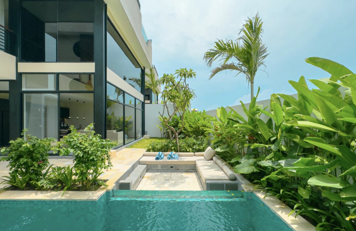  Nestled amidst the picturesque landscapes of Pererenan, just a leisurely stroll away from Pantai Lima beach, this luxurious villa offers an exquisite fusion of tranquility, convenience, and captivating entertainment possibilities. Crafted with masterful design, the villa sprawls across 260 square meters of land, boasting 288 square meters of living space across three levels of architectural elegance. Floor-to-ceiling glass doors and windows adorn the structure, affording stunning vistas of lush rice fields and majestic mountains. Upon entering the ground floor, one is greeted by a lofty living area with soaring ceilings, complemented by a modern, fully-equipped kitchen and a chic dining space. Here, a 9x3m swimming pool beckons, encircled by a sundeck and a cozy lounge area, perfect for unwinding. The master bedroom, with direct access to the pool, features a dedicated workspace, enhancing productivity while indulging in serenity. Ascend to the first level to discover two additional bedrooms, each with en-suite facilities and panoramic views of the natural surroundings. The pièce de résistance awaits atop the villa – the top-floor master bedroom, a sanctuary of relaxation and awe-inspiring vistas. Spaciously appointed, it boasts a lavish en-suite bathroom adorned with a skylight, allowing natural light to cascade in abundantly. Slide open the doors to reveal a private roof terrace, where a luxurious Jacuzzi invites indulgence amidst panoramic splendor. An inviting U-shaped seating area sets the stage for unforgettable sunset experiences, where one can savor favorite beverages while witnessing the sky ablaze with vibrant hues as the sun gracefully sets. This opulent villa is offered fully furnished and available for a 25-year lease, with the option to extend for 30 years at market price. It represents a compelling investment opportunity with a promising return on investment (ROI). Bali's flourishing tourism industry, coupled with the burgeoning popularity of Pererenan and its vibrant environs, ensures robust demand for upscale accommodations. Investors stand to benefit from attractive rental income potential and the prospect of property value appreciation, making it an irresistible opportunity for discerning individuals seeking lucrative return prices. 
