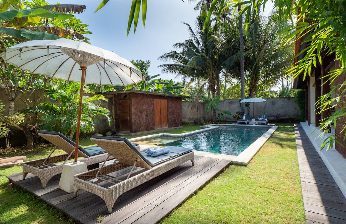 This charming ocean-side villa offers very attractive rental returns with a 75% occupancy rate delivered in 2022. It can also be your paradise home and a perfect place for relaxation, a tropical escape, mind-body rejuvenation, spa treatments, yoga practice, or a romantic getaway. The villa is conveniently placed less than 200 meters away from the ocean in Tejakula, North Bali. It is equipped with an independent entry leading to a fully fenced private space. The space offers a fully furnished contemporary 100m2 Balinese style building with two spacious en-suite bedrooms, an open concept living/kitchen/dining area, an 8meters long private swimming pool, and a natural tropical garden, all in a cozy setting of 325m2 land size. It is tastefully decorated using custom-made furnishings and natural materials. Each bedroom is equipped with a king-size bed, a built-in wardrobe, and a large modern bathroom with a hot water rain shower and an outdoor private little garden. Villa was recently refurbished and renovated in December 2022. We offer an independent villa built on freehold land, with a registered government electric supply, internet connection, and free water supply from a well inside the villa. It is a registered business with a completed website, Google registration, Airbnb, and Booking.com listings. You can immediately start generating very attractive rental returns.