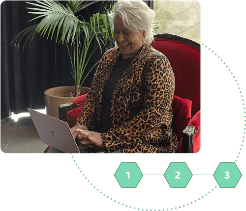 Bonsai team member Lisa Watts sits at the laptop