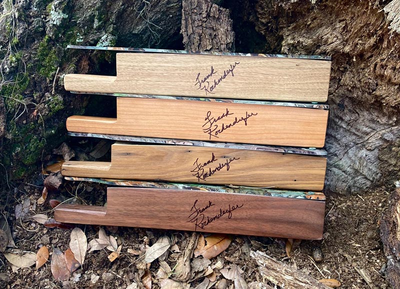 4 different kinds of turkey calls stacked on top of one another in the woods