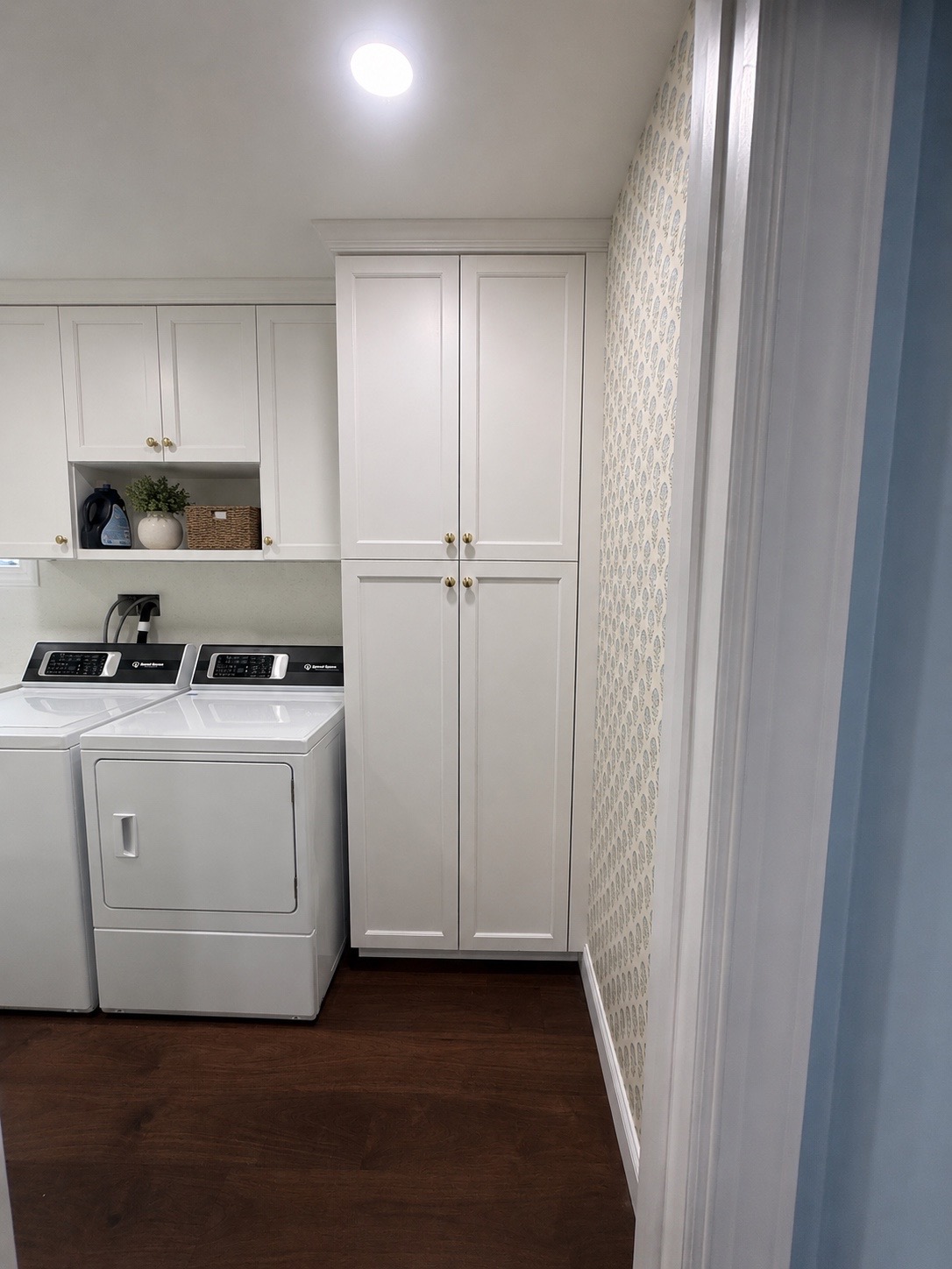 tall thinkfloor to ceiling cabinets in custom laundry room 
