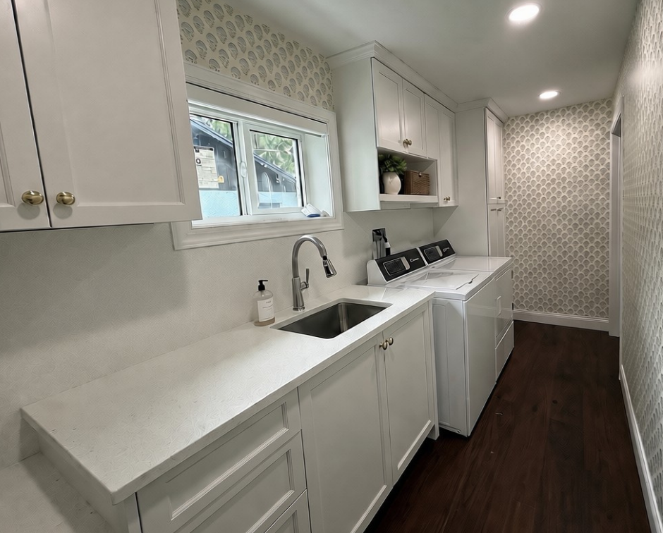 custom white cabinets and countertops in laundry room