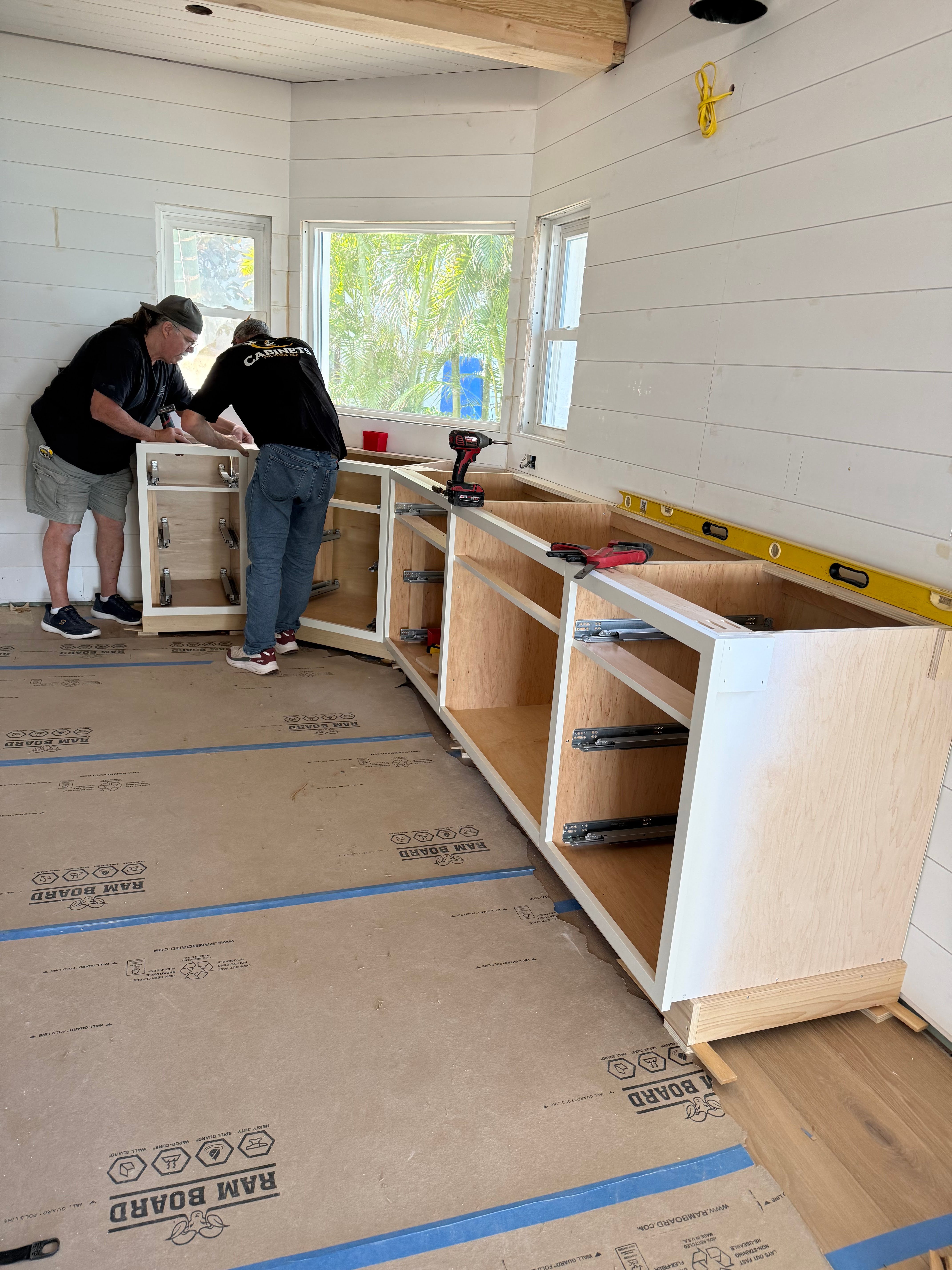 Cabinet Chic craftsmen working on installing cabinetry