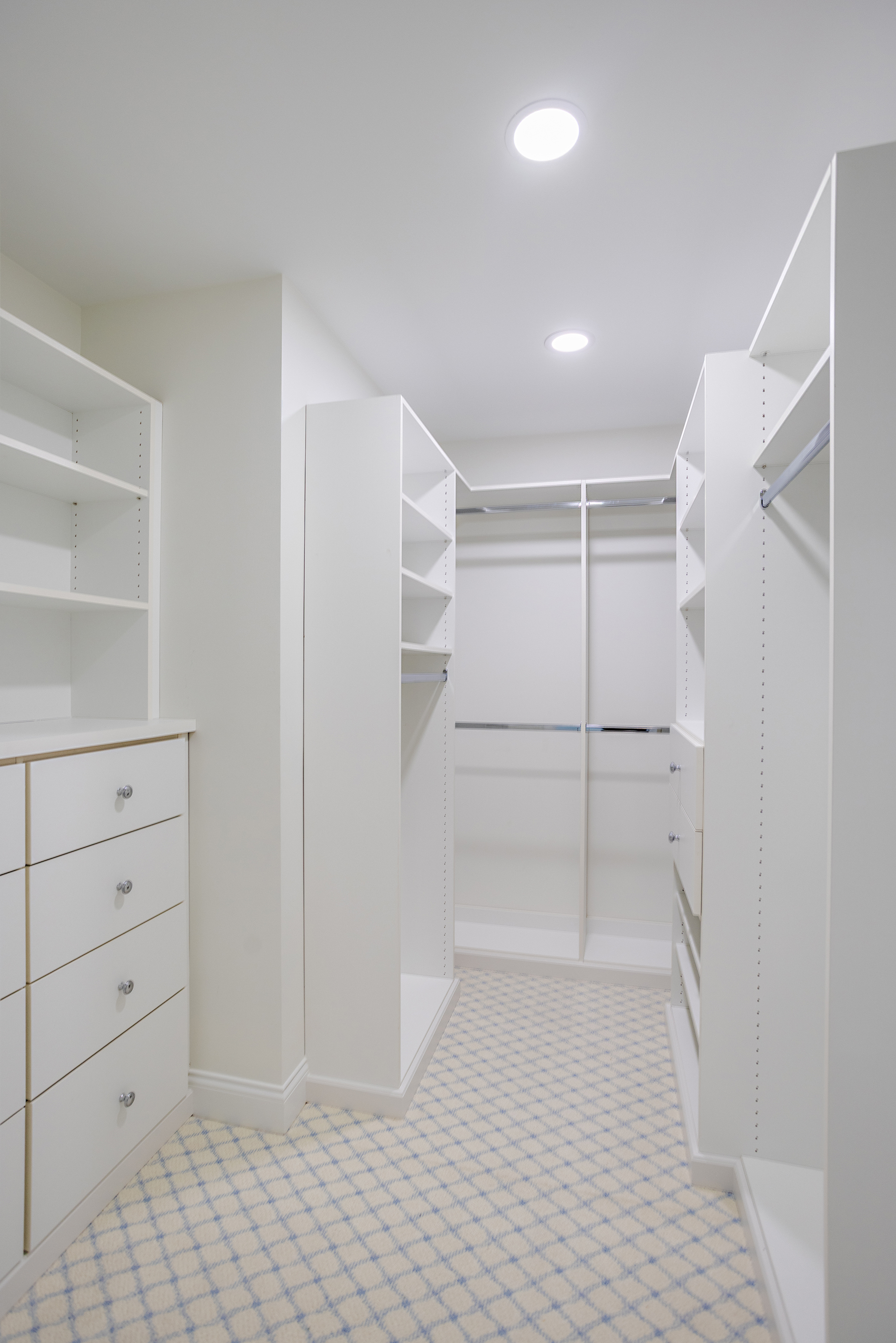 custom built closet with white shelving