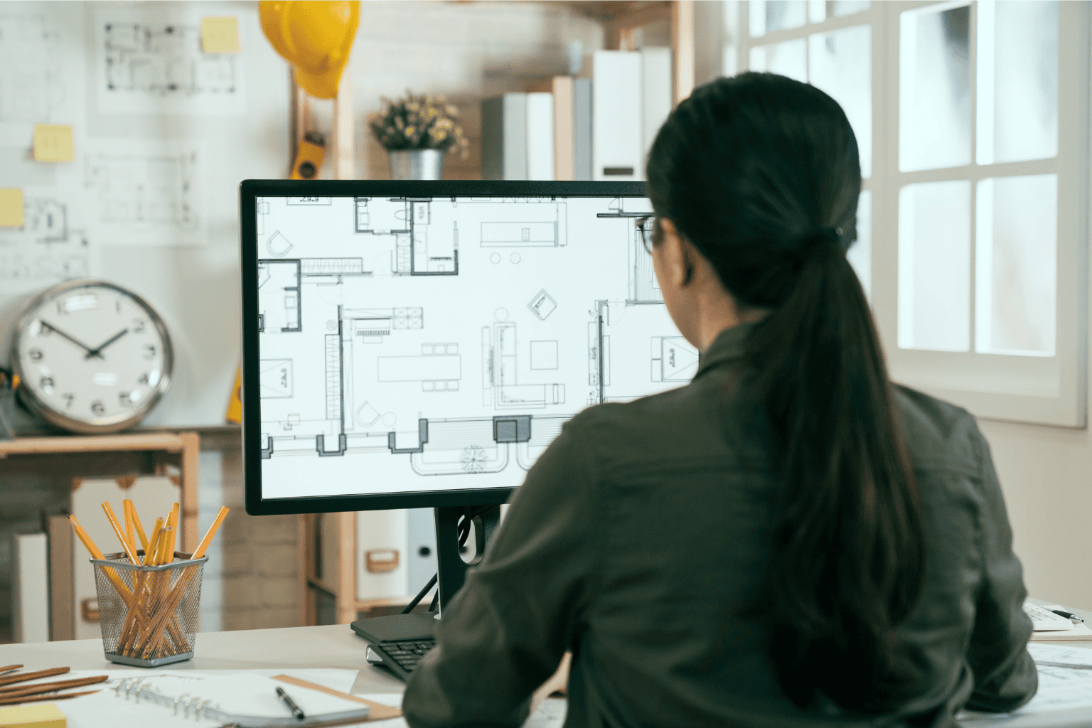 Woman working on desktop computer