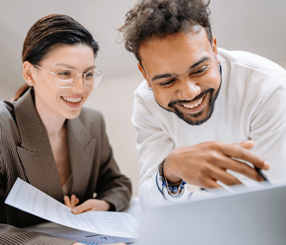 Two young professionals looking at laptop