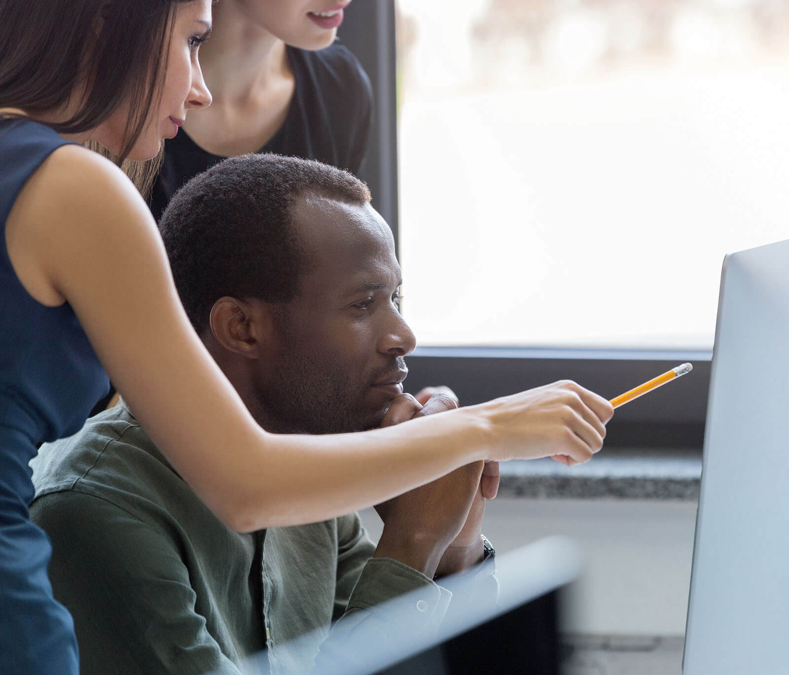 Two people looking at computer screen