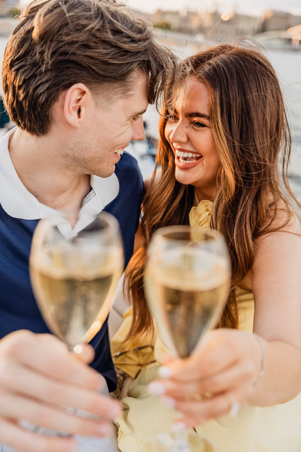 A couple with champagne on a boat in Barcelona