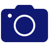 Icono de cámara azul oscuro con una lente circular en el centro.
