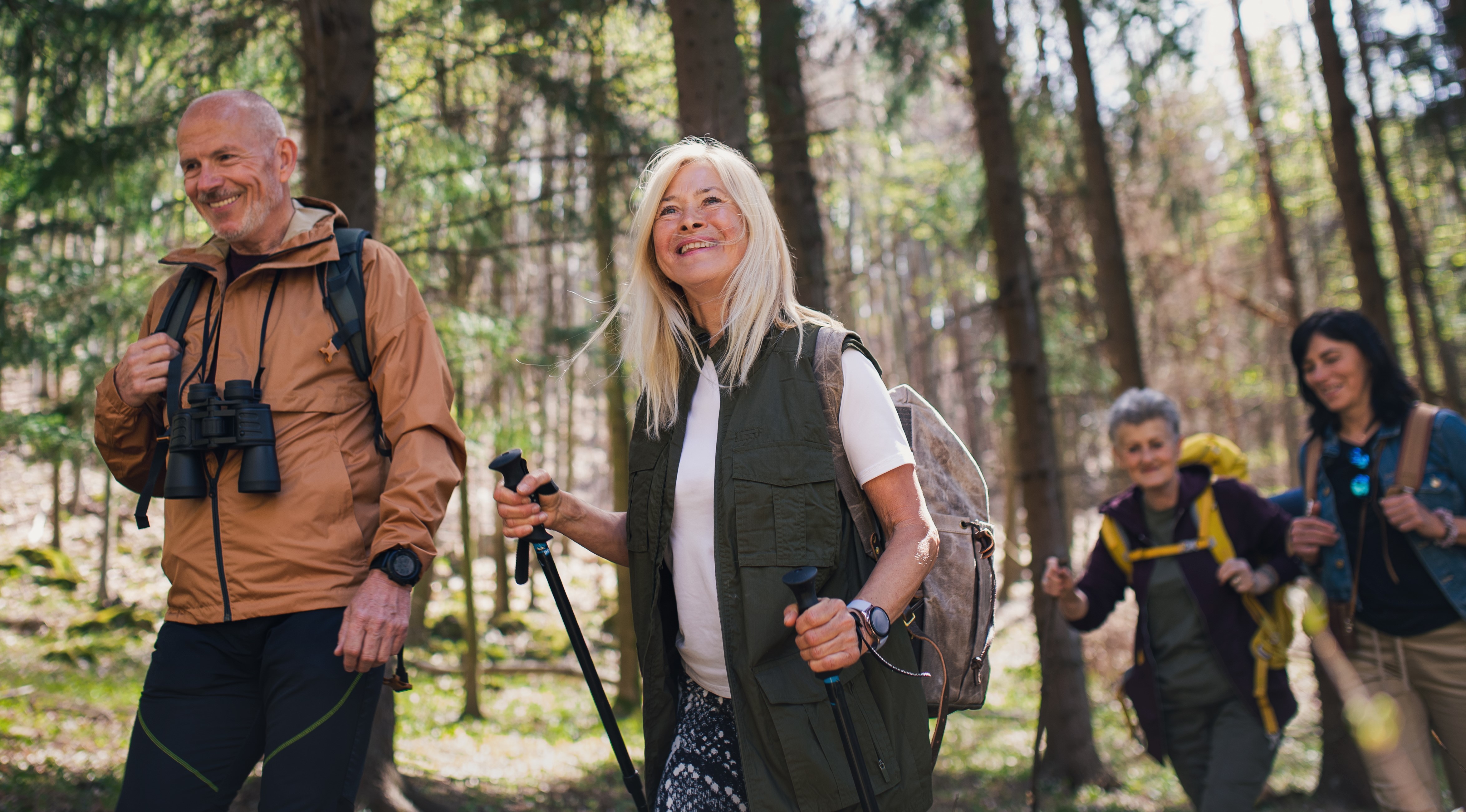 Man walking through forest with nephew - IHT