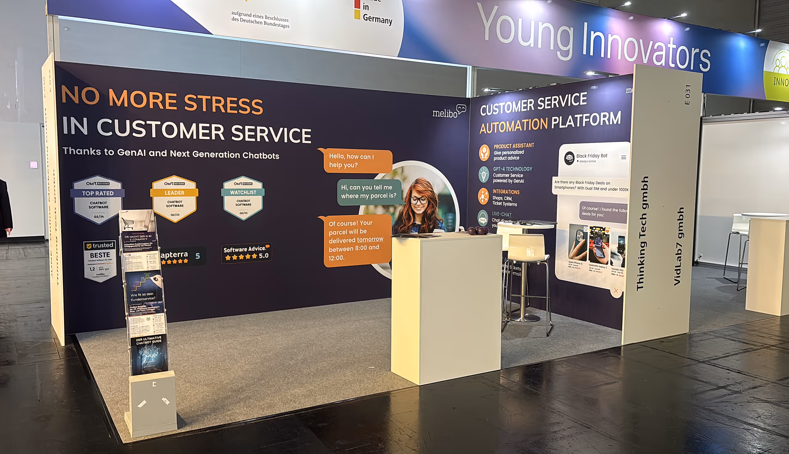 Exhibition booth with banners promoting a customer service automation platform using AI chatbots, featuring text about stress-free customer service and badges for chatbot software ratings.