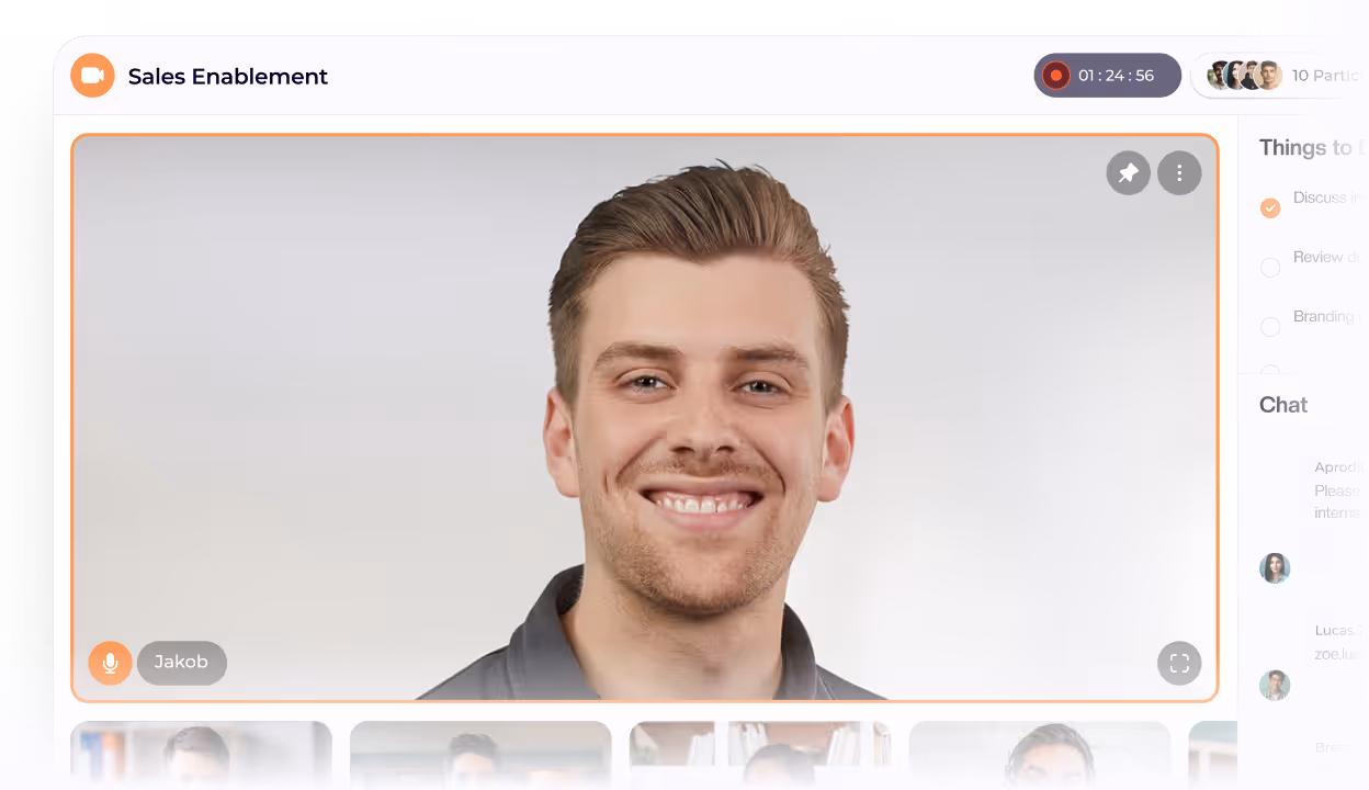 Smiling man with light brown hair in a video call window labeled 'Sales Enablement'.