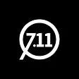 White circular logo with text '711' inside and a tail extending from the circle on black background.