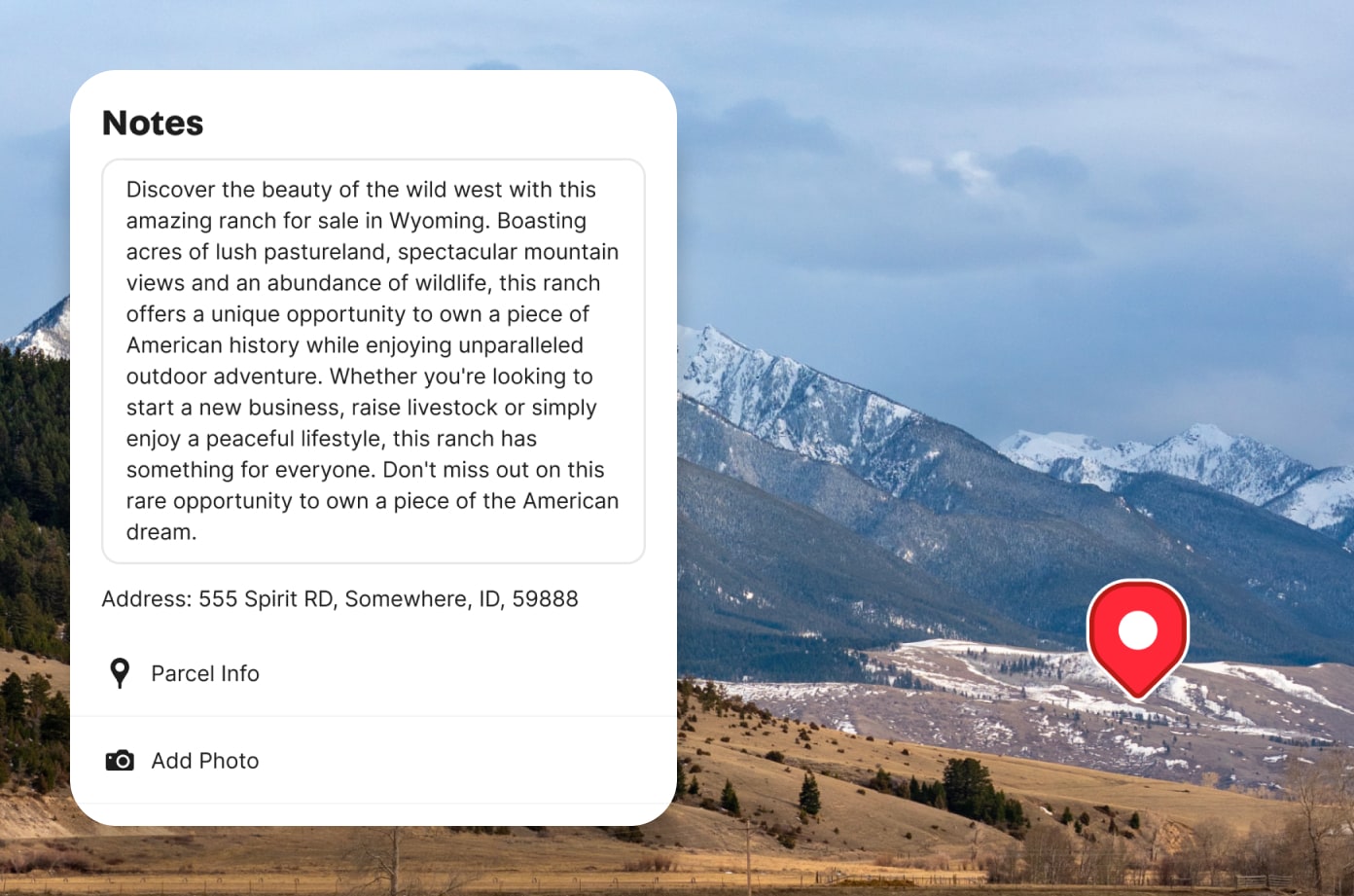 A composite image showing a mountain landscape in the back with a waypoint icon. Overlaid on top is a note input by a Land id user.