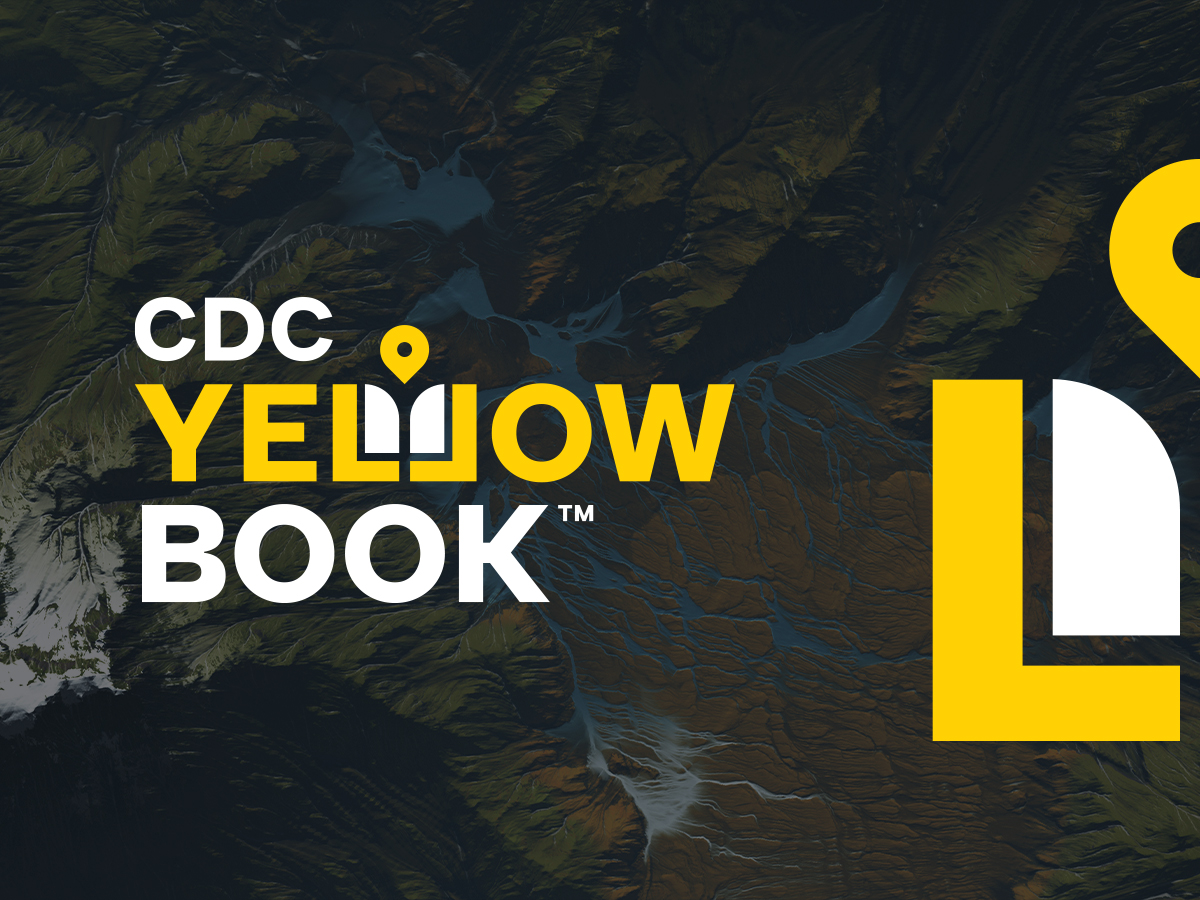The CDC Yellow Book wordmark over an aerial landscape photograph, with a location pin set into the letter O.