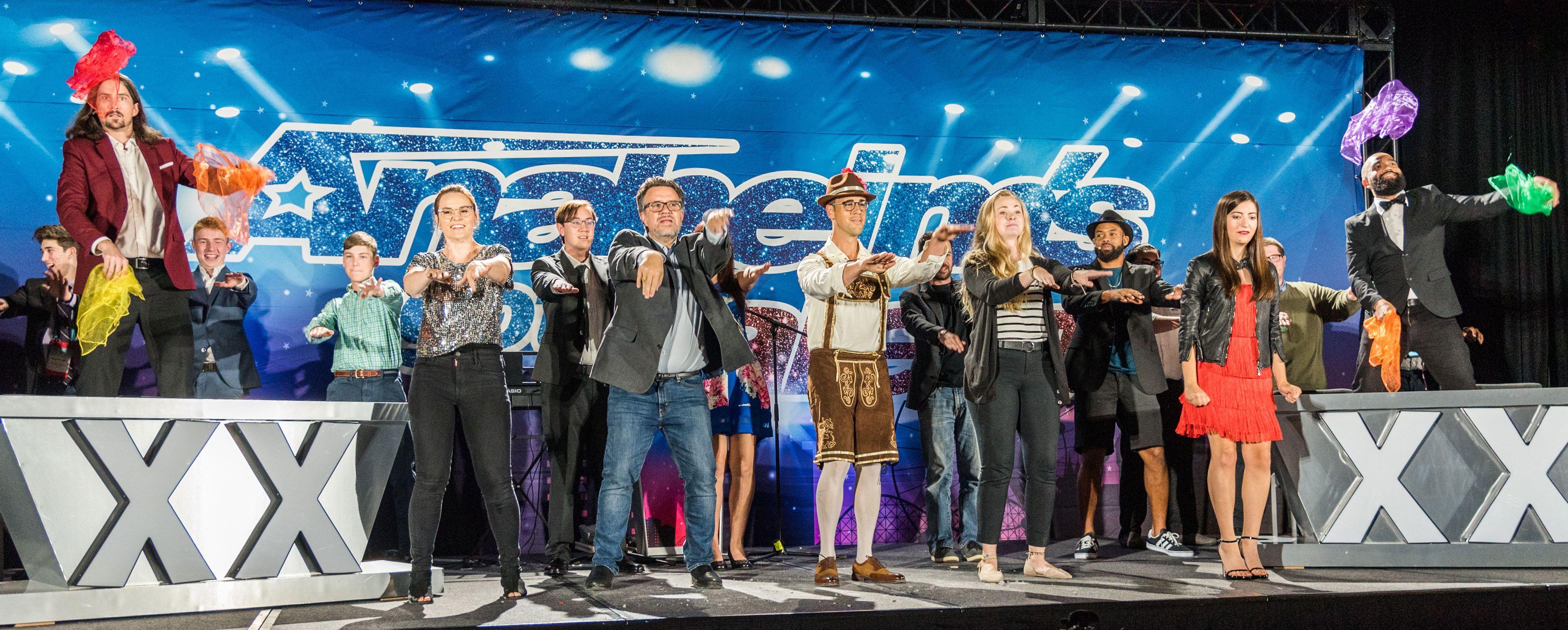 Teen honorees celebrating on stage in front of the Anaheim's Got Talent backdrop.