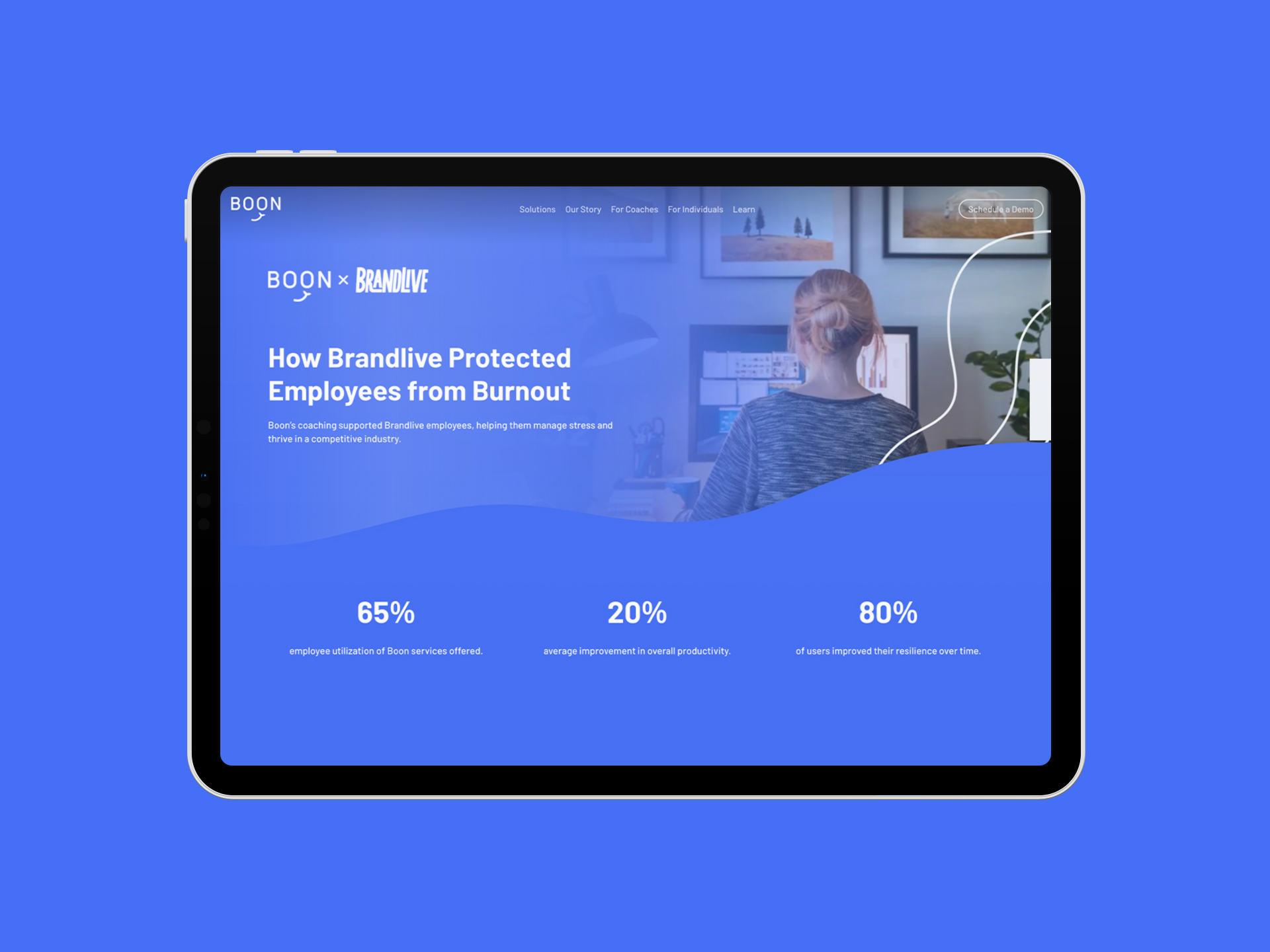 A tablet showing a co-branded Boon case study, “How Brandlive Protected Employees from Burnout,” with three headline statistics.