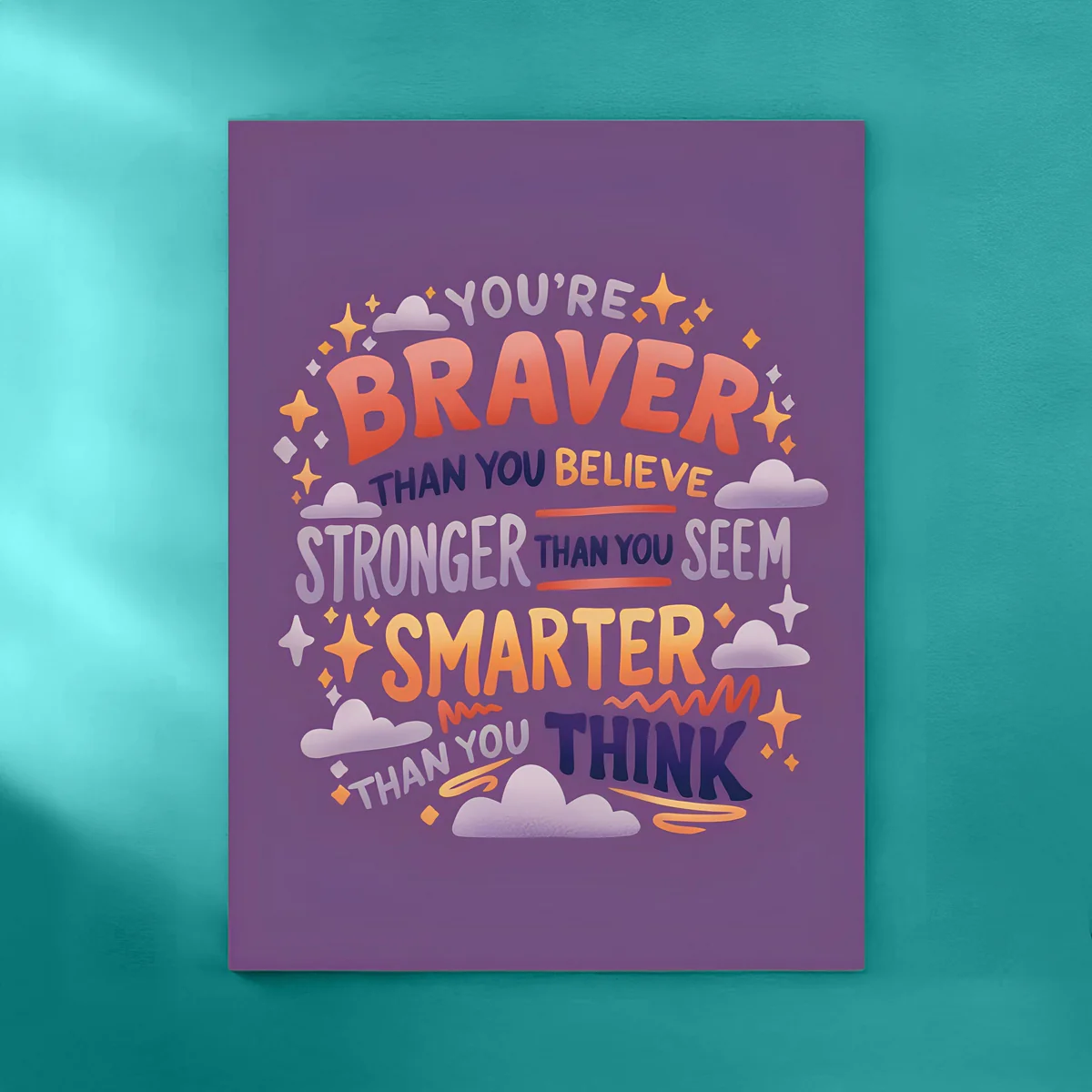 A hand-lettered print reading “You're braver than you believe, stronger than you seem, smarter than you think.”