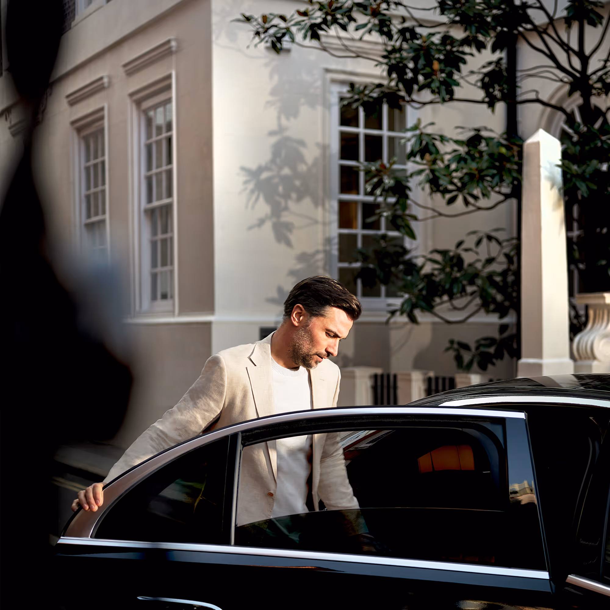 A man getting in a car