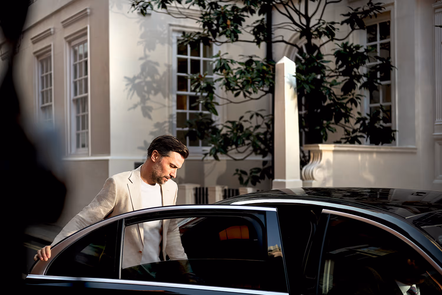 A man getting in a car